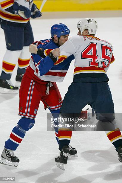 Matthew Barnaby of the New York Rangers and Brad Ference of the Florida Panthers fight eachother during the game at National Car Rental Center in...