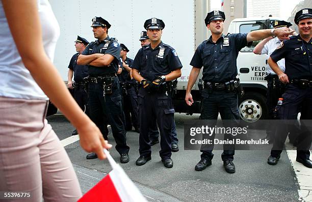 New York City Police officers direct pedestrian traffic in front of the Waldorf Astoria September 13, 2005 in New York City. Security is on high...