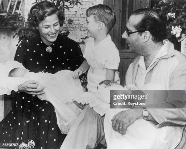 Swedish actress Ingrid Bergman with her husband, film director Roberto Rossellini , their son Roberto Ingmar Rosselini, and their three-week old...