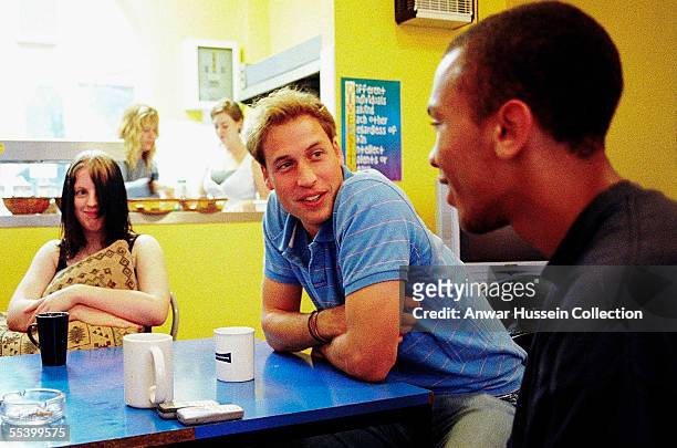In this handout photo released on September 13, 2005 Prince William speaks to young people during a volunteering visit to homelessness charity...