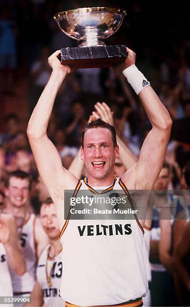 Christian Welp of Germany celebrates with the trophy after winning the final match Russia aganist Germany of the Basketball 1993 European...