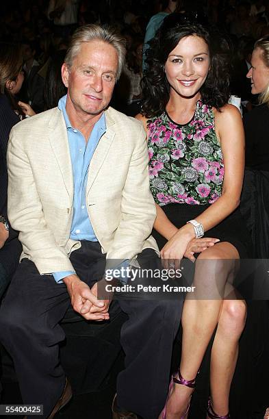 Actor Michael Douglas and his wife actress Catherine Zeta Jones attend the Michael Kors Spring 2006 fashion show during Olympus Fashion Week at the...