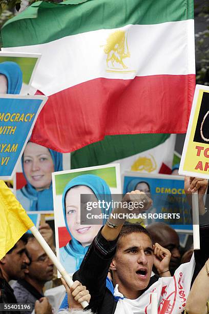 New York, UNITED STATES: Eftekhari Sasan of Lille, France, cheers shouts during a rally protesting Iranian President Mahmoud Ahmadinejad's visit to...