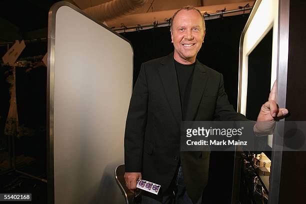 Designer Michael Kors poses backstage at the Michael Kors Spring 2006 fashion show during Olympus Fashion Week at the New York Public Library...