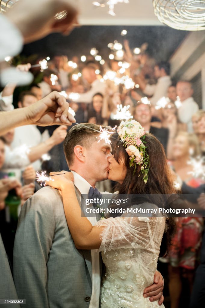 Bride and groom kissing.