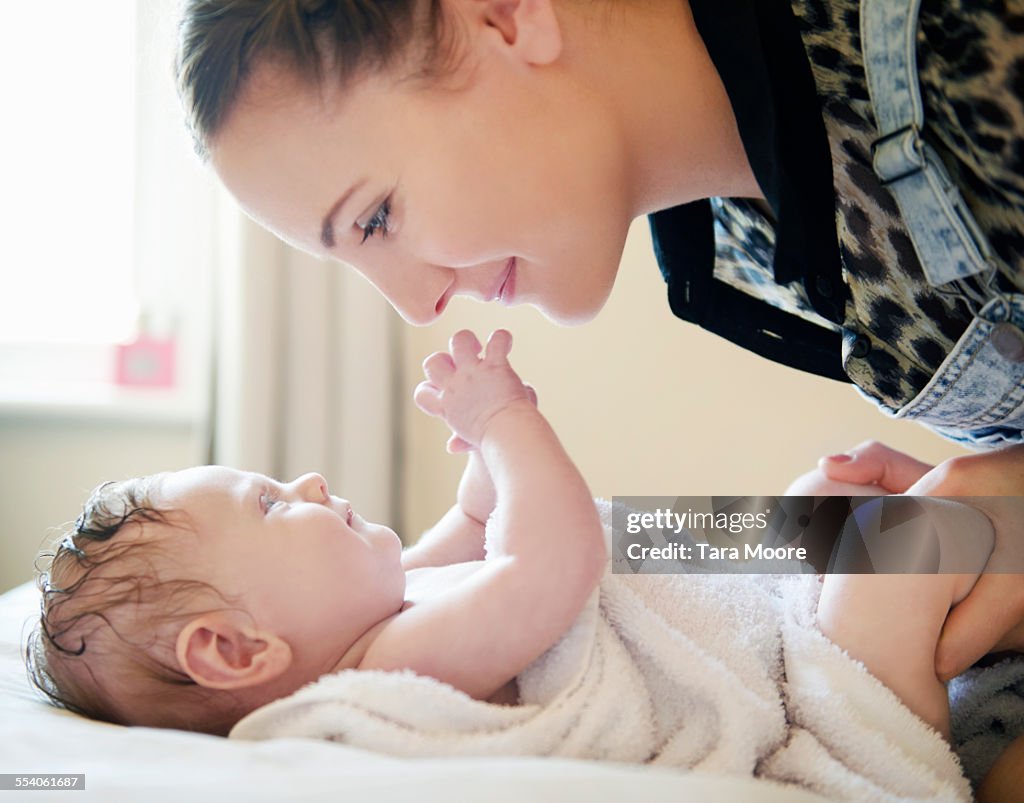 Mother playing with baby