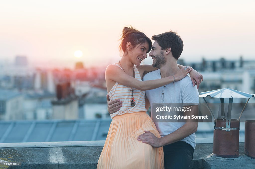 Romantic couple on rooftop, Paris