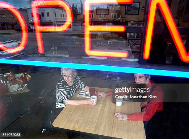 senior couple in a restaurant - open day 2 stock pictures, royalty-free photos & images