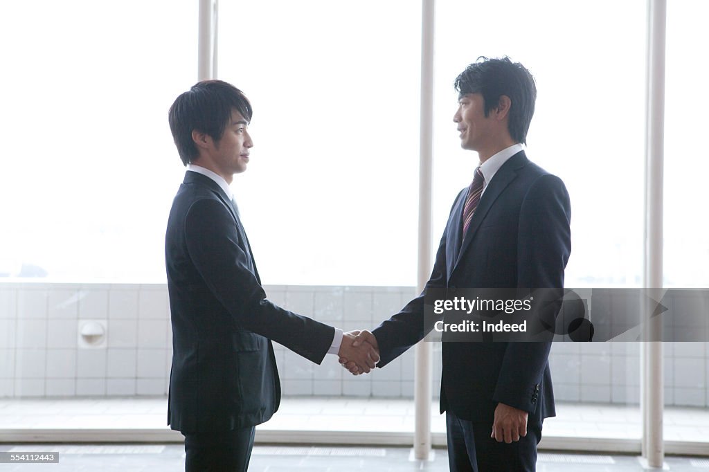 Two men shaking hands