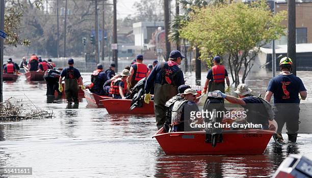 Rescue crews head out to continue to search the neighborhoods surrounding the Elysian Fields area over two weeks after the Hurricane Katrina swept...