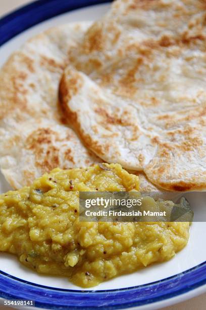 roti canai or roti pratha and dhal sauce - roti canai stock pictures, royalty-free photos & images