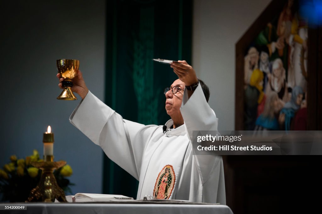 Priest giving sermon in Catholic church