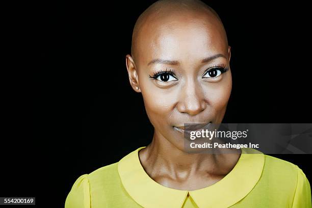 close up of face of african american woman - lady face black background happy stock-fotos und bilder