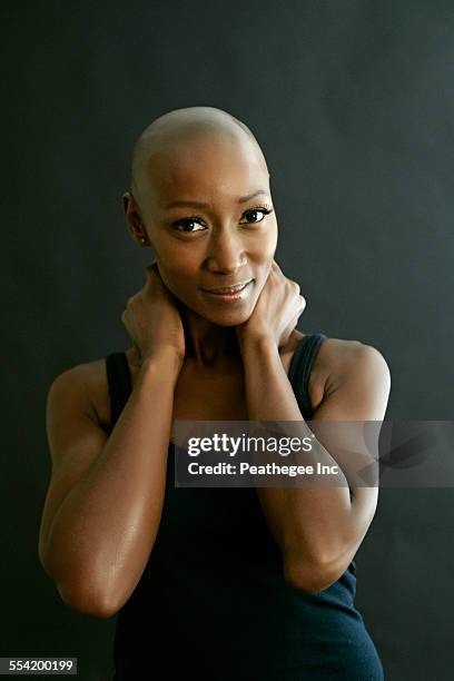 african american woman smiling - shaved head stock pictures, royalty-free photos & images
