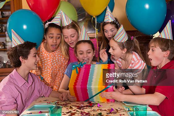 kids opening presents at birthday party - open day 13 stock pictures, royalty-free photos & images