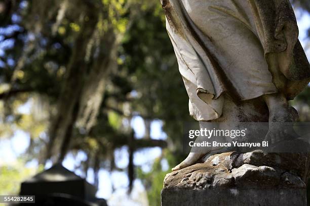 a closed up view of tomb statue - bonaventure cemetery stock pictures, royalty-free photos & images
