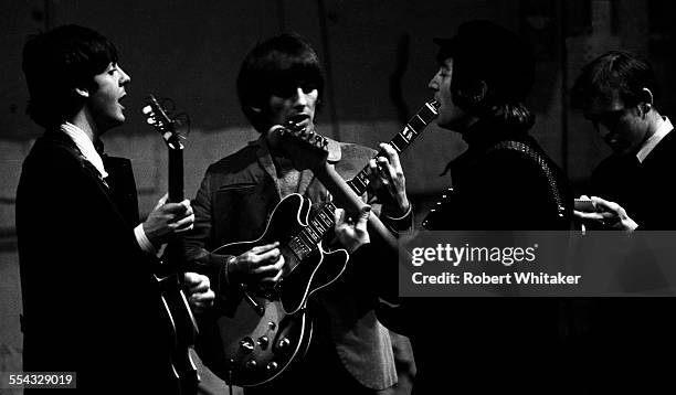 Paul McCartney, George Harrison, John Lennon and Neil Aspinall are pictured at the Donmar Rehearsal Theatre in central London during rehearsals for...