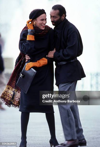 Well-dressed couple wear the latest in fall and winter fashions, New York, 1980s.