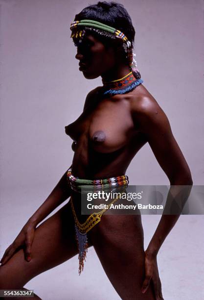 Portrait of actress, musician, and model Grace Jones, wearing tribal-inspired clothing, 1970s.