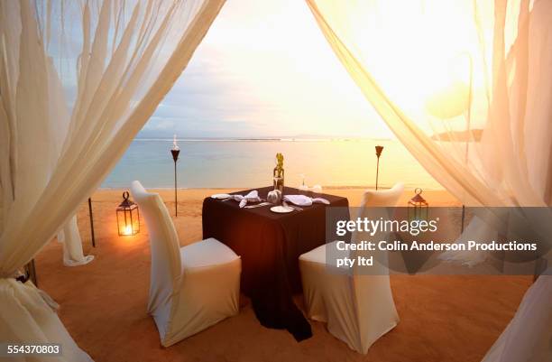 table prepared for romantic dinner at beach - 豪華　食事 ストックフォトと画像