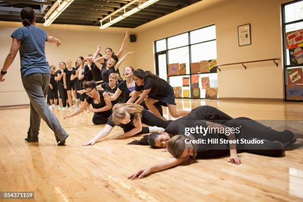 teenage dancers rehearsing with teacher in studio - contemporary dance stock pictures, royalty-free photos & images