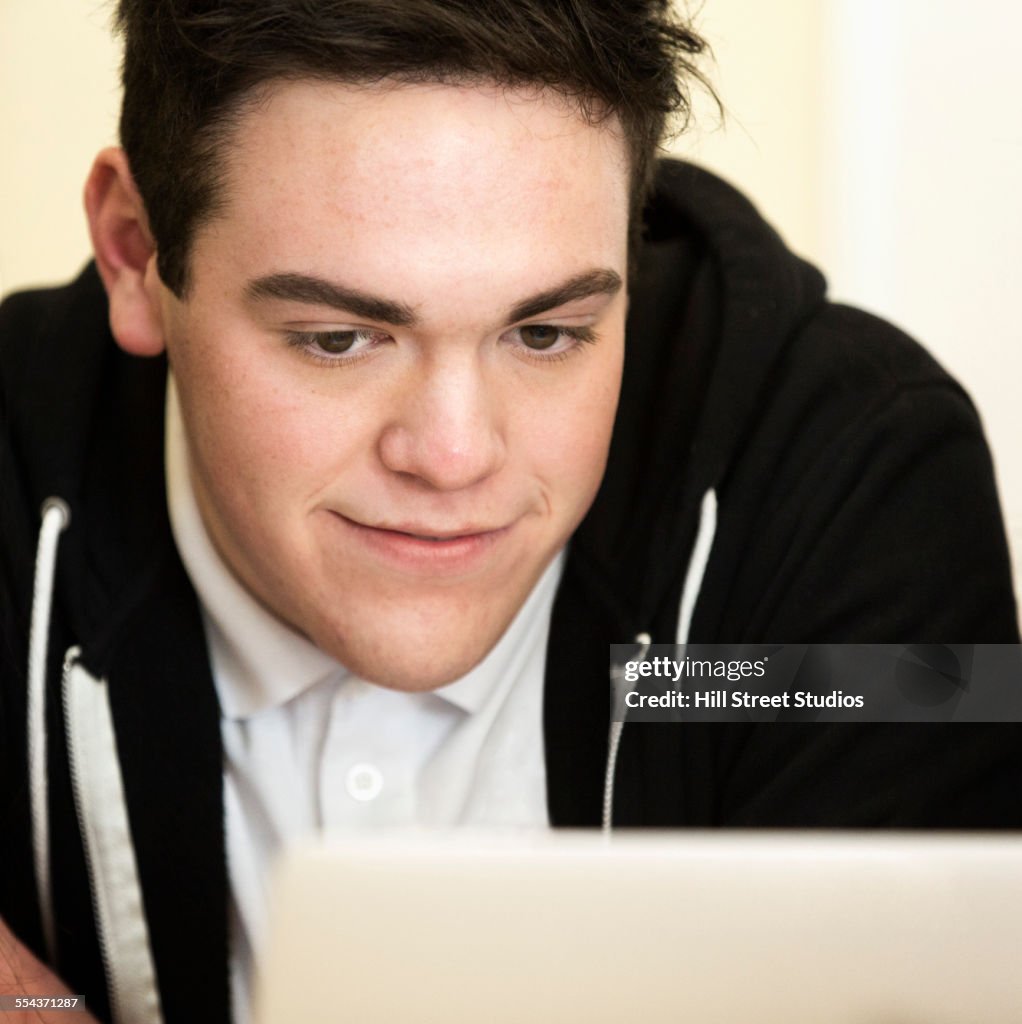 Student using laptop in class