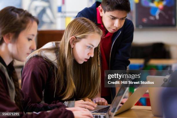 students using laptop at desk in class - idaho stock pictures, royalty-free photos & images
