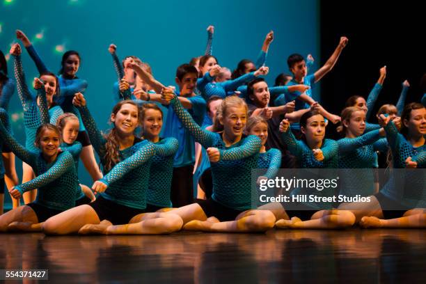 dancers performing on stage - girl stage stock-fotos und bilder