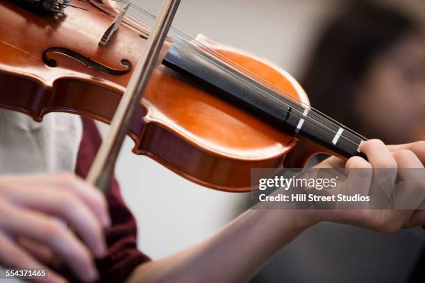 caucasian student musician playing violin - violin ストックフォトと画像