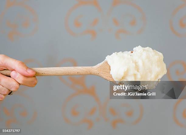 close up of mashed potatoes on wooden spoon - mashed potatoes stock pictures, royalty-free photos & images