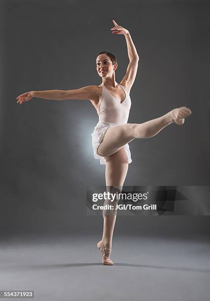 hispanic ballet dancer posing on tip toe - ballet legs stock pictures, royalty-free photos & images