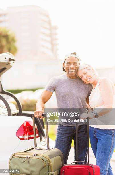 older couple with luggage on vacation - フロリダ州 ジュピター ストックフォトと画像