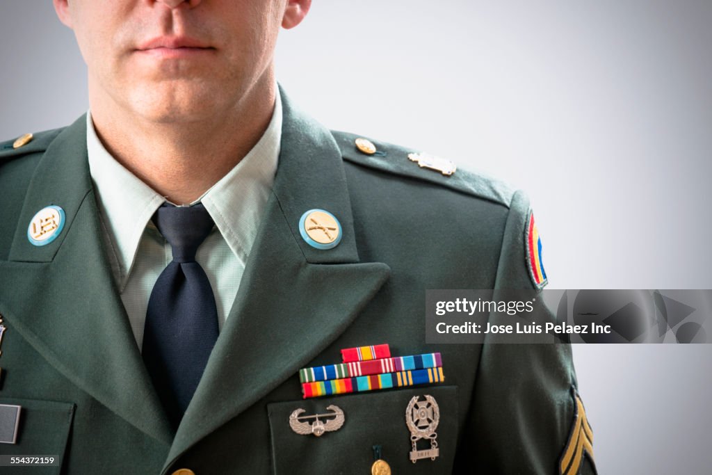 Close up of Caucasian soldier wearing decorated military uniform