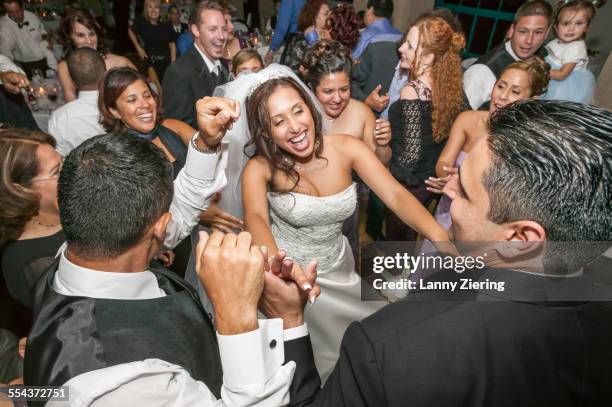 high angle view of bride and groom dancing at wedding reception - bride smiling stock pictures, royalty-free photos & images