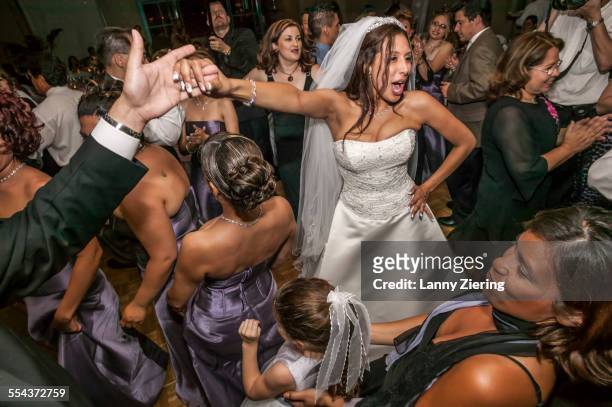 high angle view of bride and groom dancing at wedding reception - huwelijkspartij stockfoto's en -beelden