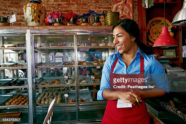 hispanic waitress taking orders in bakery - small business lunch stock pictures, royalty-free photos & images