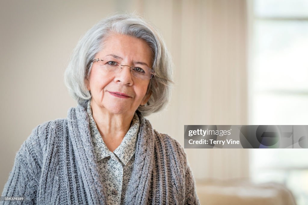 Close up of serious face of older Hispanic woman