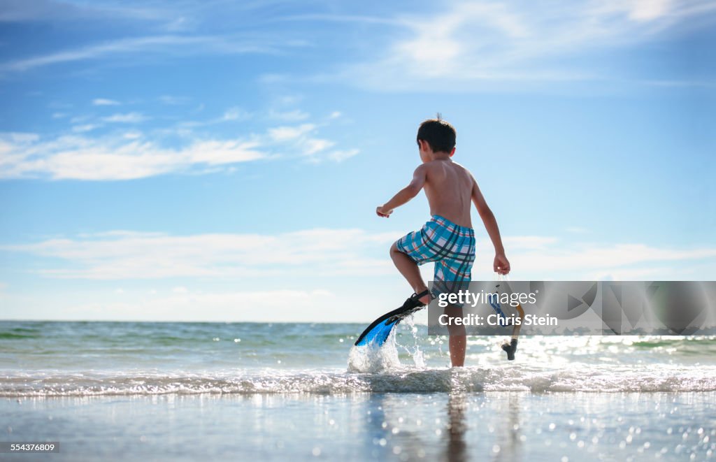 Youth half Asian Korean healthy boy happily playin