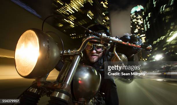 man riding motorcycle at night - flying goggles stock pictures, royalty-free photos & images