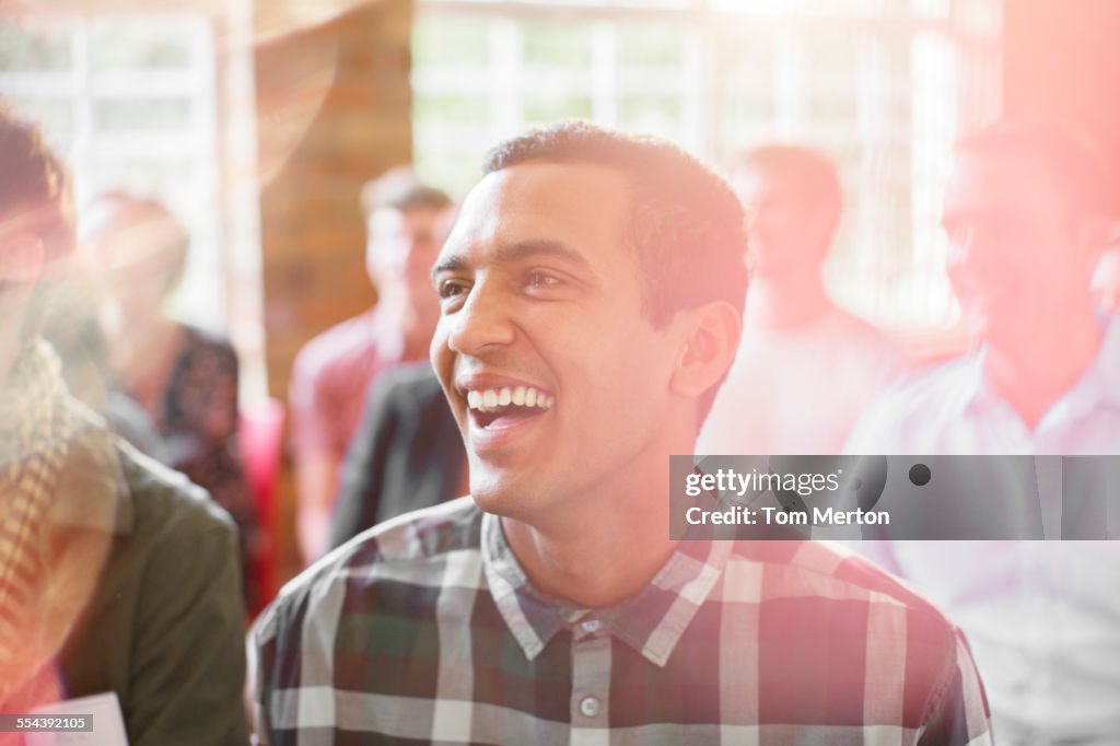 Man laughing in audience