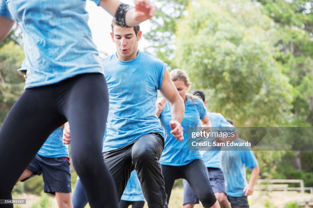 Determined man on boot camp obstacle course