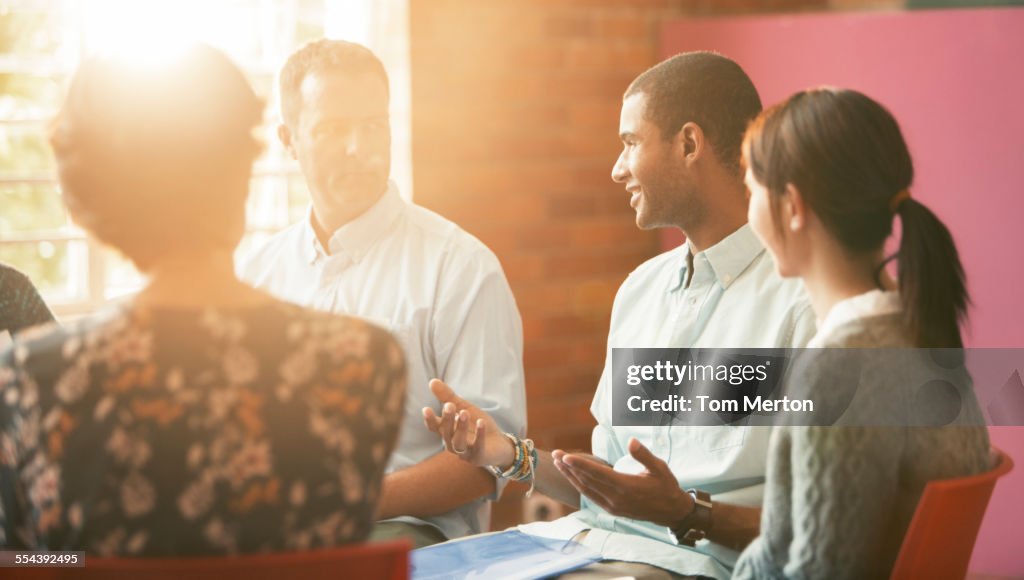 Man talking in group therapy session