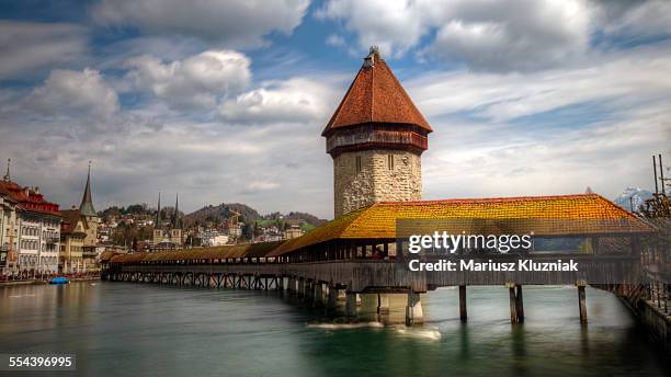 lucerne historic wooden chapel bridge and old town - kapellbrücke stock-fotos und bilder