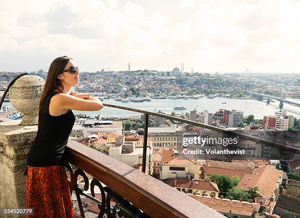 young woman looking at istanbul from galata tower - golden horn stock pictures, royalty-free photos & images