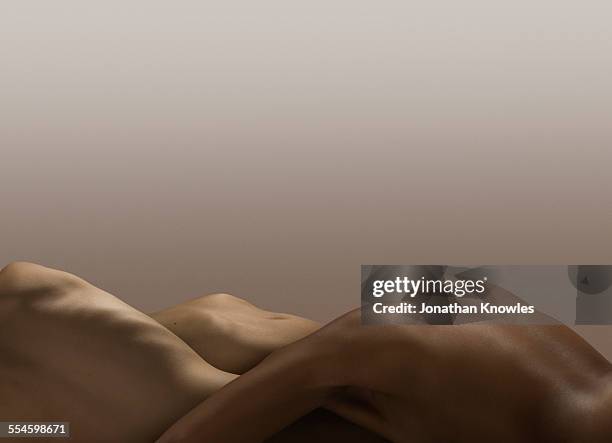 abstract nude bodies, different skin colours - female derriere stockfoto's en -beelden