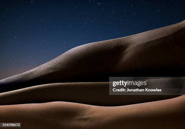 three arms against starry night, close up - abstract color person stock pictures, royalty-free photos & images