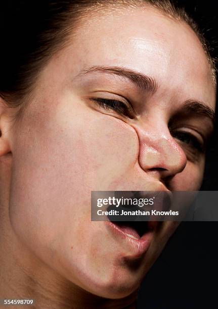 side of female's face pressed against glass - distorted body image stock pictures, royalty-free photos & images