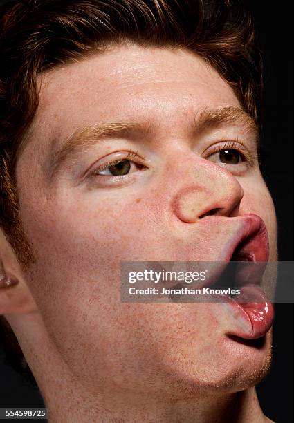 side of male's face pressed against glass - distorted body image stock pictures, royalty-free photos & images