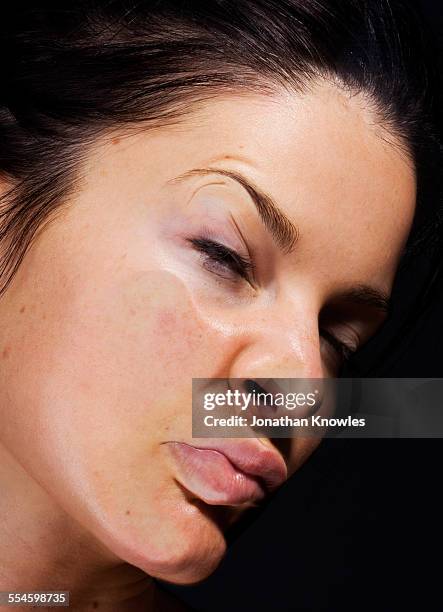 side of female's face pressed against glass - distorted body image stock pictures, royalty-free photos & images