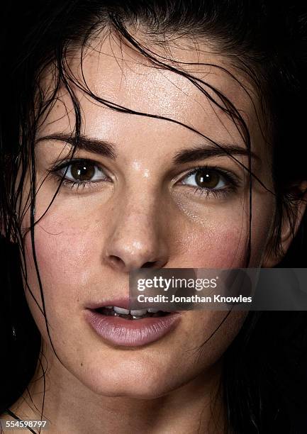 wet hair falling on female's wet face - nasses haar stock-fotos und bilder